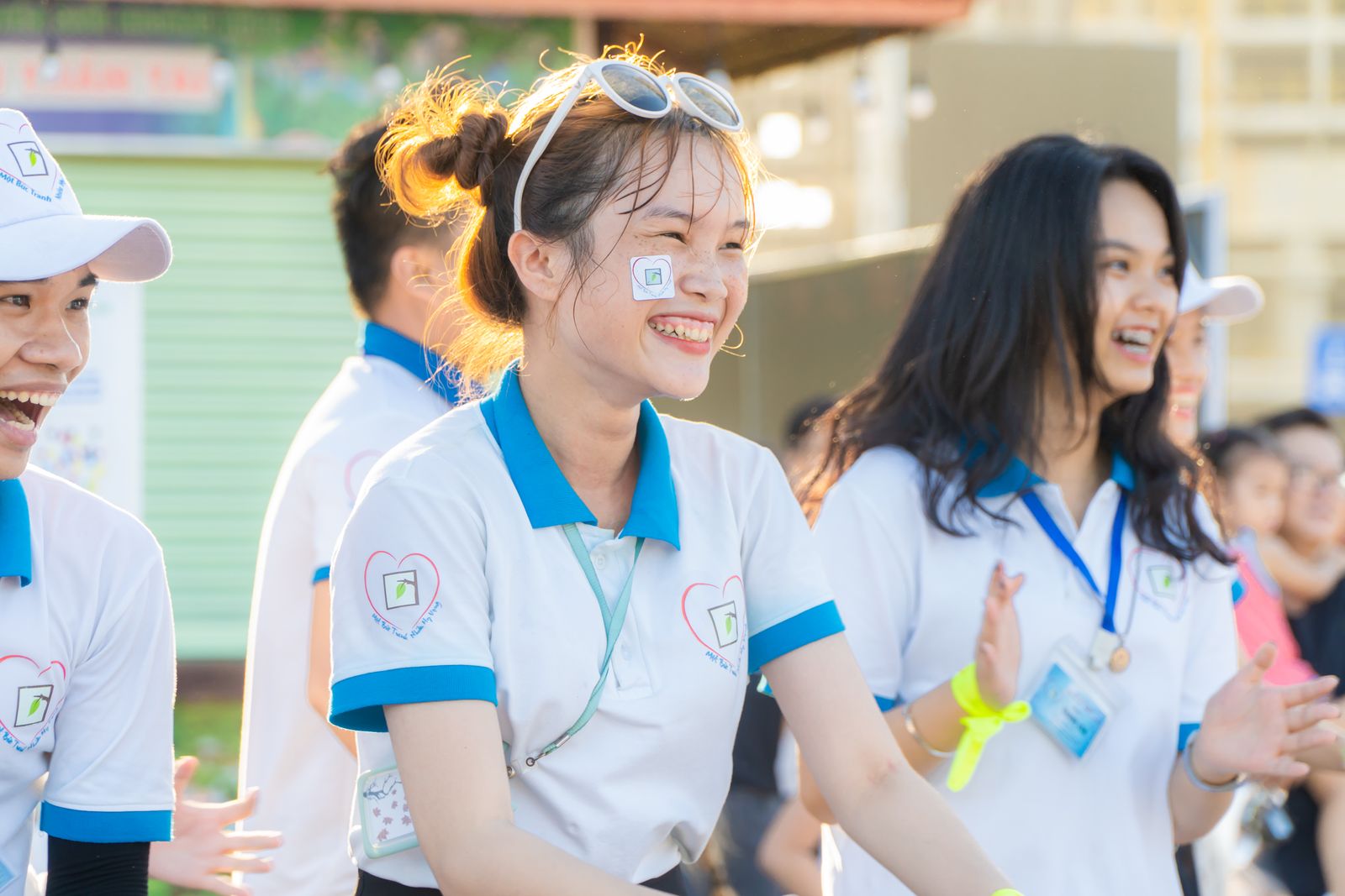 A group of young volunteers smiling together outdoors